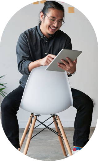 Person sitting in chair with a pad and paper